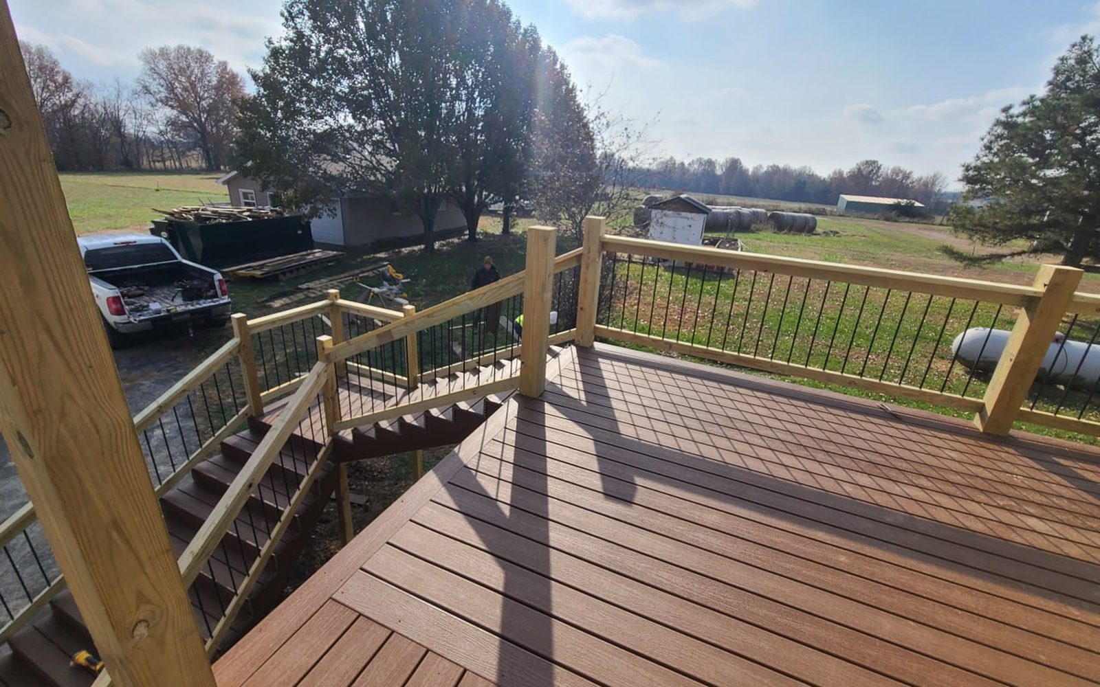 New composite deck and railing overlooking a Missouri farm field